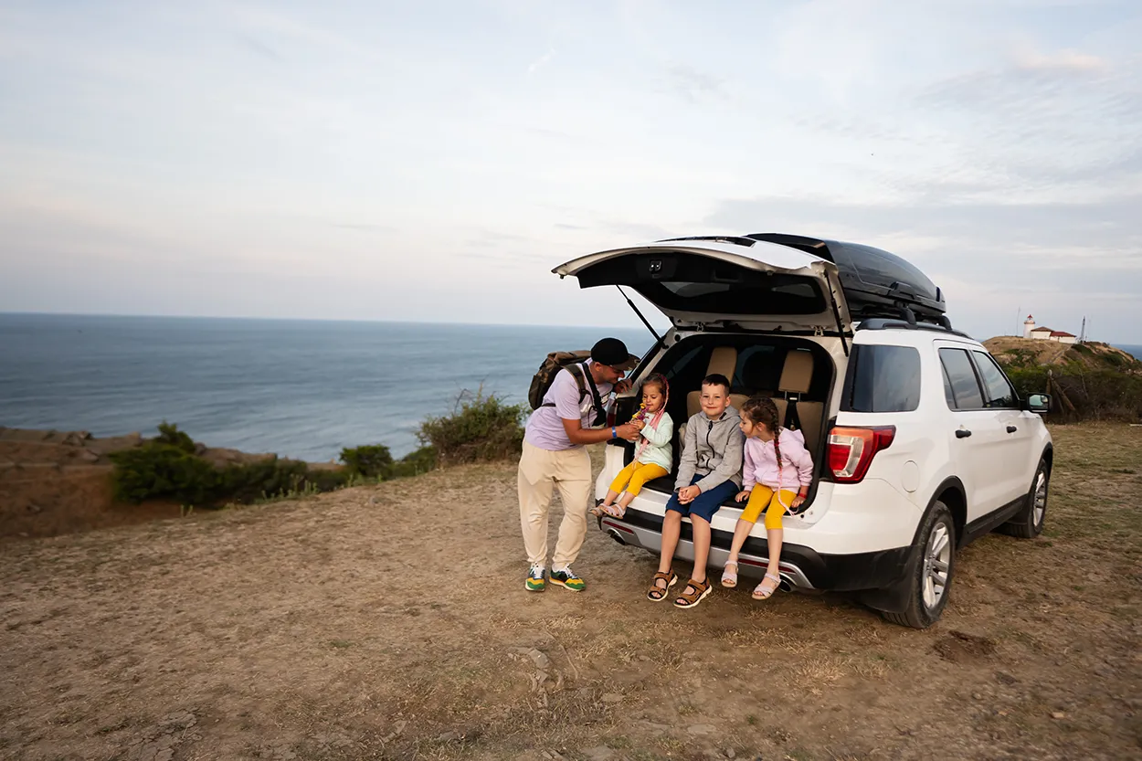 Family Sitting in the Back of a SUV