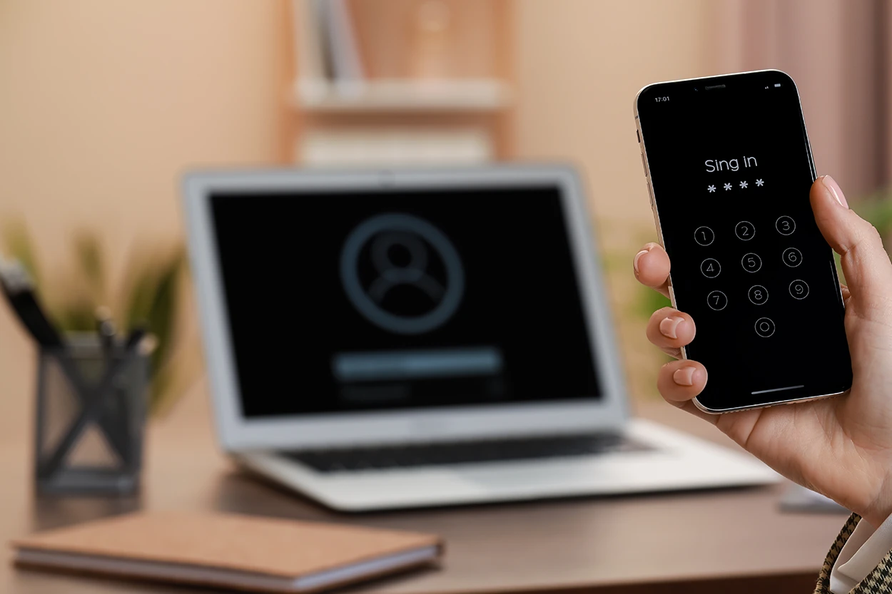 Photo of laptop with mobile phone
