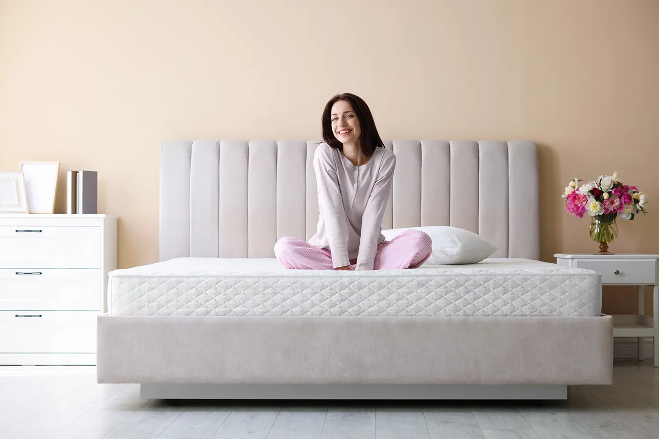 woman sitting on a mattress